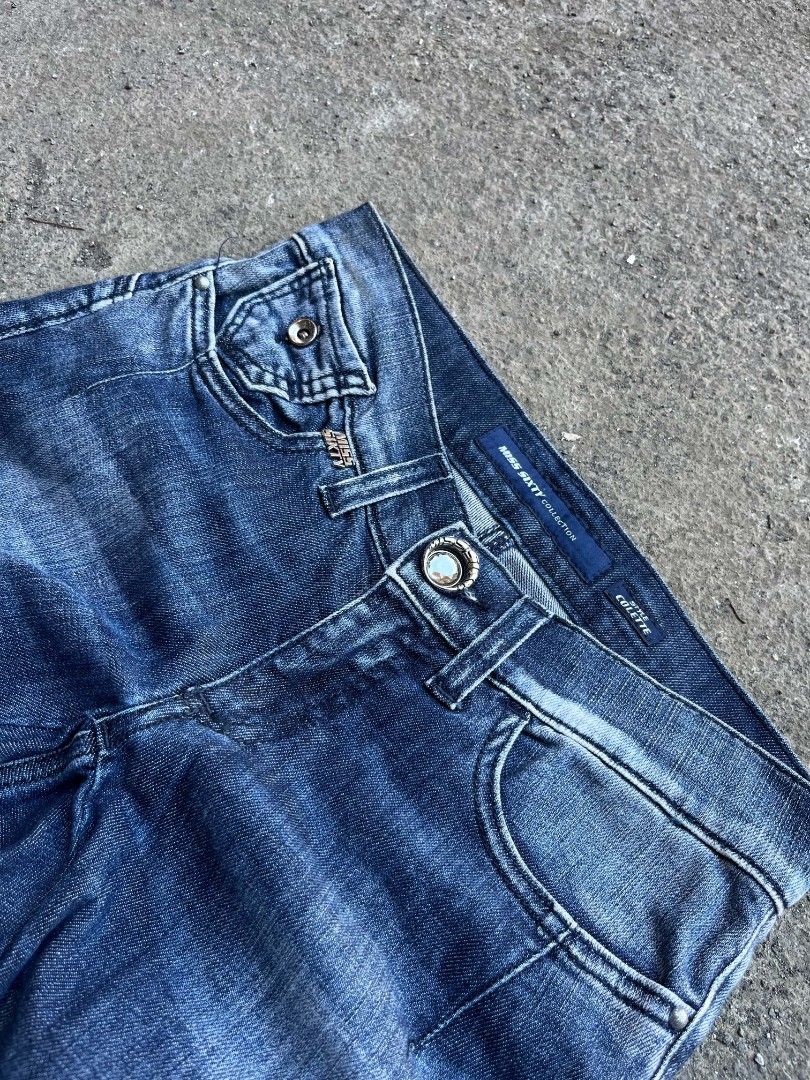 Miss Sixty Colette Denim Jeans (Category: Jeans) located in Nagcarlan. Submitted by jjakeclare74057 (Listing ID 1465749542, Image 3). Description: - Brand/Model: Miss Sixty Colette Denim Jeans - Wash: Medium blue with heavy Y2K vintage fading - Fit: Low rise with structured seaming and flare bootcut leg - Details: Branded buttons, rivets, metal '60' logo on back pocket - Special Feature: Leather waist patch with metallic floral embellishments - C