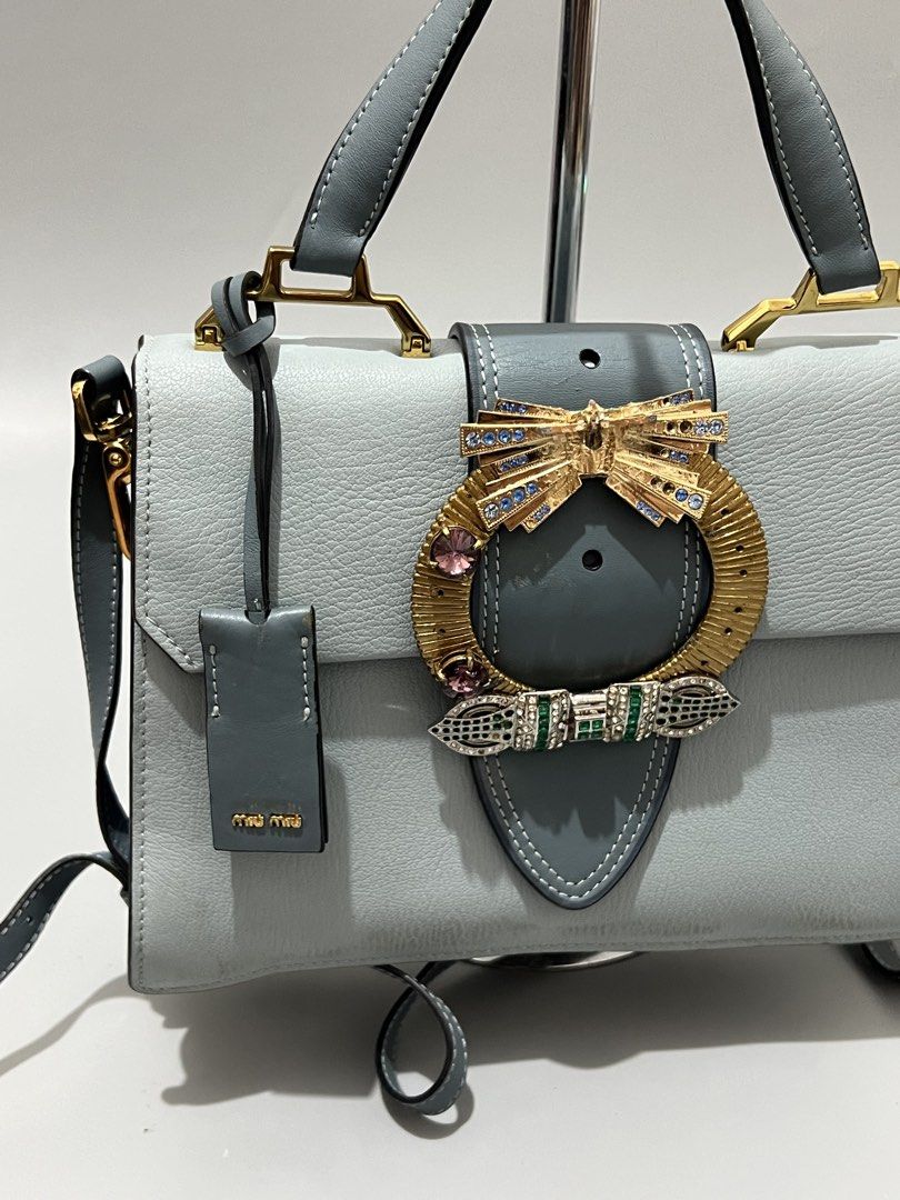 MIU MIU - Madras Crystal - Leather (Category: Cross-body Bags) located in Cavite. Submitted by asianluxe (Listing ID 1465705175, Image 2). Description: Miu Miu - Madras Crystal - Leather Measurements! Length:8 inches Width:10.5 inches Depth:3 inches Lampo Zipper Good condition Very presentable Sign of usage! Check pics.