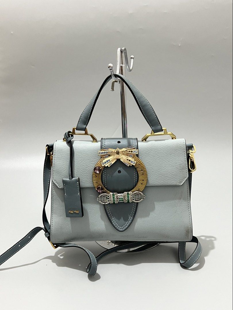 MIU MIU - Madras Crystal - Leather (Category: Cross-body Bags) located in Cavite. Submitted by asianluxe (Listing ID 1465705175, Image 1). Description: Miu Miu - Madras Crystal - Leather Measurements! Length:8 inches Width:10.5 inches Depth:3 inches Lampo Zipper Good condition Very presentable Sign of usage! Check pics.