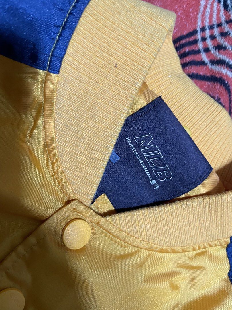 MLB Baltimore Orioles Varsity Jacket (Category: Coats, Jackets and Outerwear) located in Mandaue City. Submitted by anthony457 (Listing ID 1465644326, Image 3). Description: - Official MLB Baltimore Orioles satin bomber jacket - Eye-catching yellow body with contrast navy blue sleeves - Large team script across the chest and embroidered bird logo patch on the left sleeve - Classic snap button closure - Comfortable striped ribbed collar, cuffs, an