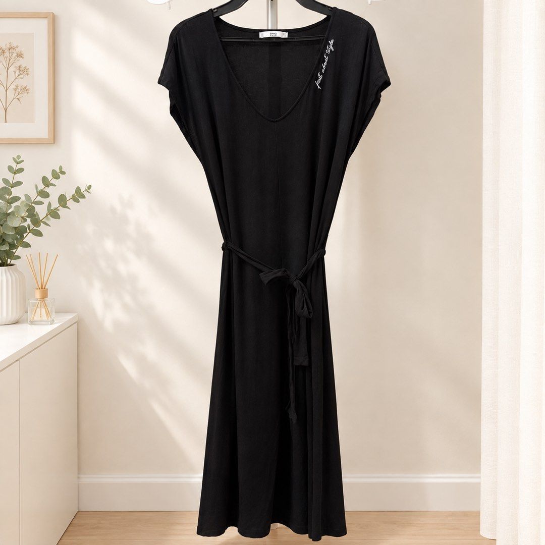 Mango Basics Black V-Neck Dress with Tie Belt (Category: Dresses) located in Marikina City. Submitted by preloved_n_reloved (Listing ID 1465628749, Image 1). Description: - Brand: Mango Basics - Size: EUR M (USA S) - Color: Black with subtle white embroidered lettering near left shoulder - Style: Midi length, deep V-neckline, short cap sleeves - Features: Includes matching fabric waist tie for an adjustable fit - Material: Lightweight and comfort