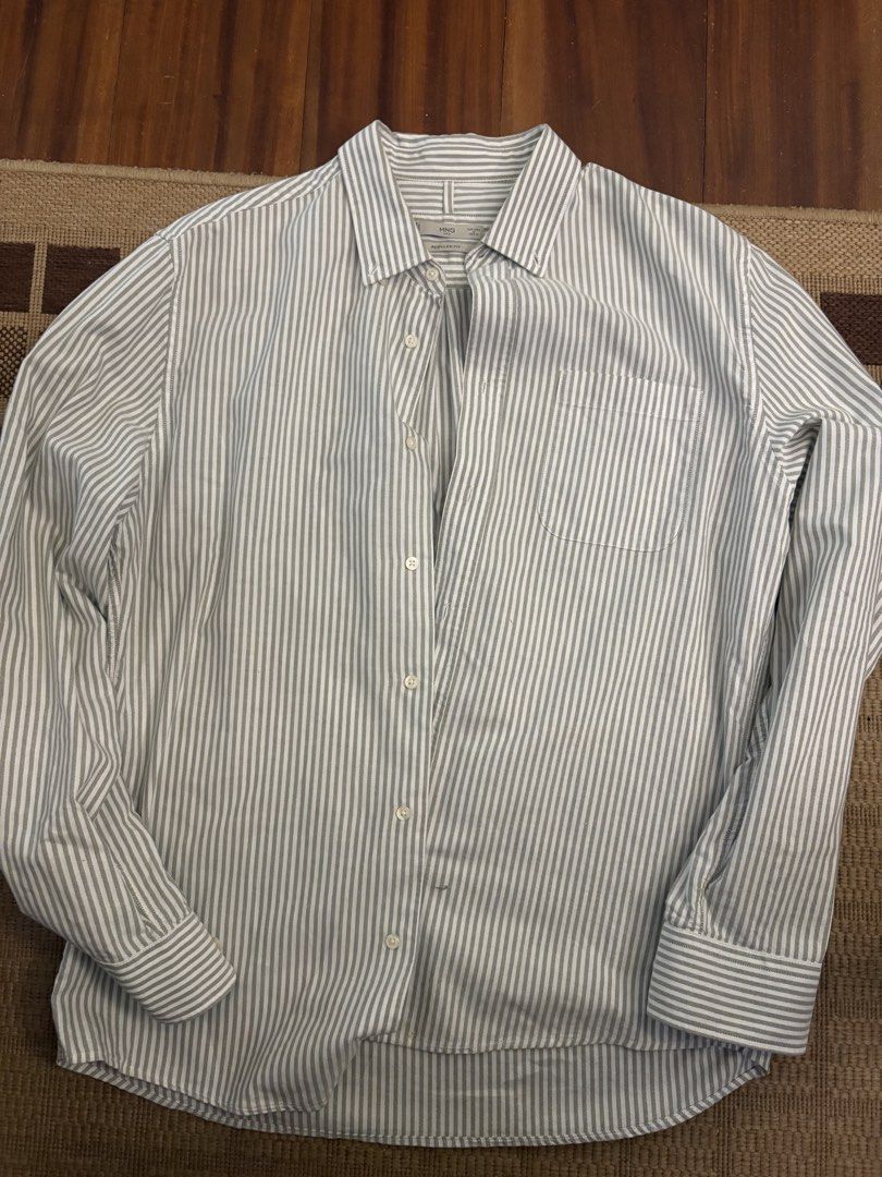 MNG Man Striped Long Sleeve Regular Fit Button-Down Shirt (Category: Formal Shirts) located in Paranaque City. Submitted by max_bully014 (Listing ID 1465609778, Image 1). Description: - Brand: MNG Man - Style: Long sleeve button-down shirt with classic collar - Color/Pattern: White with grey vertical stripes - Fit: Regular fit - Features: Single chest pocket, buttoned cuffs - Condition: Excellent, clean with no stains or tears - Ideal for: Work, 