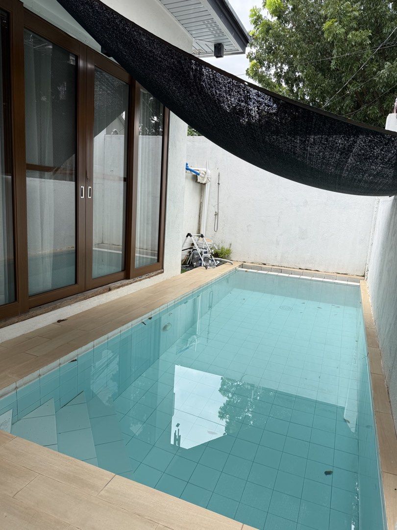 Modern House with Pool and Carport (Category: House & Lot) located in Angeles City. Submitted by juliantinio (Listing ID 1465586579, Image 3). Description: House for rent 🏡 2 bedroom 1 office 1 maids room with cr Both bedrooms with A/C Living room with A/C Powder room Dipping pool which is accessible right outside the glass sliding doors 2 car garage (automated gate) Ideal for starter family Exclusive subdivision in Angeles City Near clark, mark