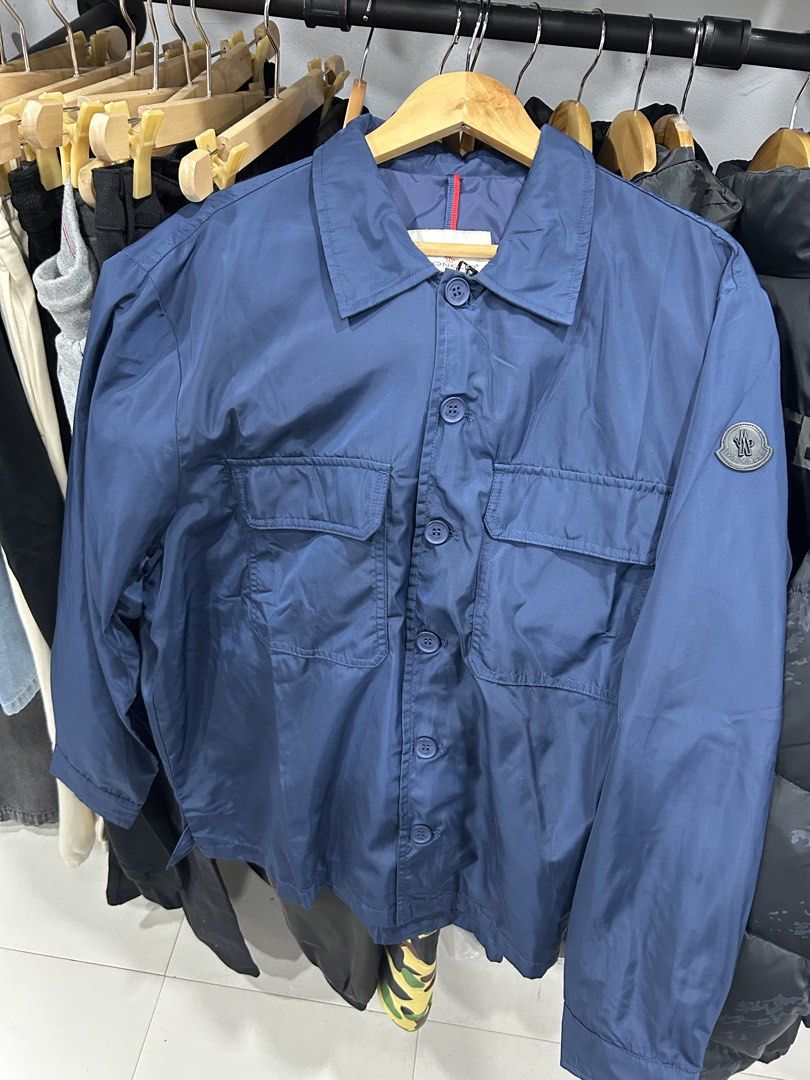 Moncler Blue Nylon Button-Up Jacket (Category: Coats, Jackets and Outerwear) located in Manila. Submitted by bodegabodega (Listing ID 1465696496, Image 1). Description: Moncler Size 6 XL fit Excellent / Like new No issue / flaws 25x28 dimensions 4k .