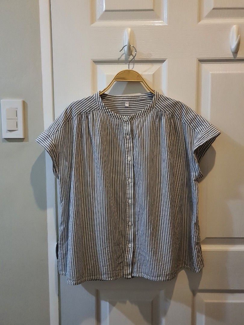 MUJI Striped Button Down Short Sleeve Blouse (Category: Blouses) located in Quezon City. Submitted by RepeatOnFleek (Listing ID 1465660185, Image 1). Description: - Brand: MUJI - Style: Short sleeve button-down shirt with classic grey and white stripes - Material: 100% cotton (super lightweight and breathable) - Fit: Relaxed fit, tagged size XS-S but may fit up to medium..kind of loose style .