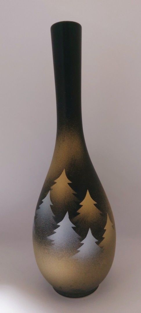 Nagayama Ceramic Bud Vase with Tree Motif (Category: Vases & Decorative Bowls) located in Cainta. Submitted by veronica2277 (Listing ID 1465636399, Image 1). Description: - Elegant black and gold ceramic bud Nagayama vase with frosted finish - Features delicate etched evergreen tree silhouettes around the bulbous body - Designed with a long slender neck and narrow opening for single or double stem - Sturdy, well-balanced shape with good weight - 