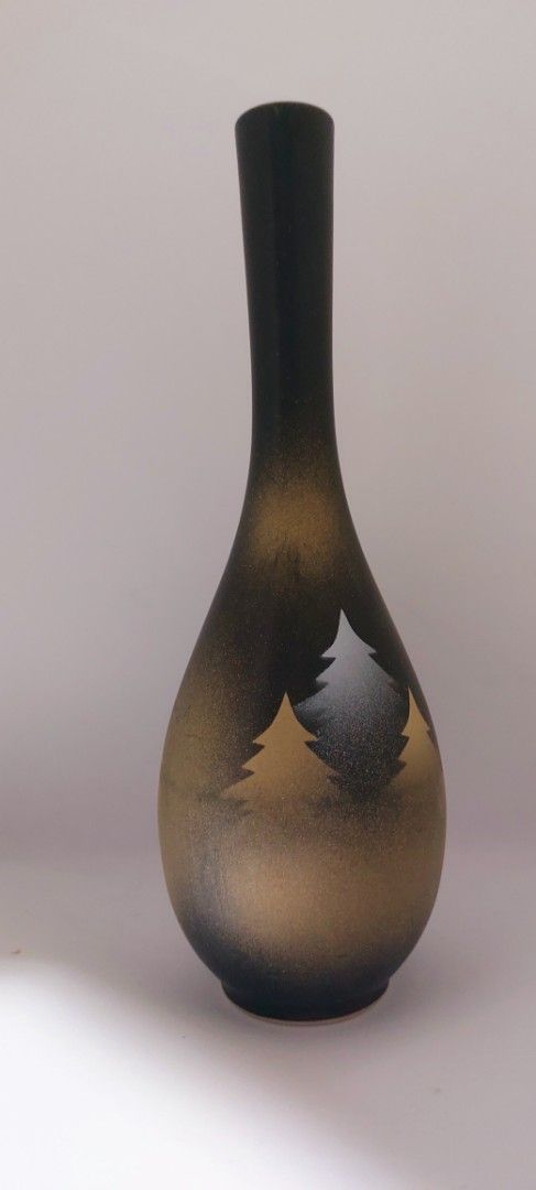 Nagayama Ceramic Bud Vase with Tree Motif (Category: Vases & Decorative Bowls) located in Cainta. Submitted by veronica2277 (Listing ID 1465636399, Image 2). Description: - Elegant black and gold ceramic bud Nagayama vase with frosted finish - Features delicate etched evergreen tree silhouettes around the bulbous body - Designed with a long slender neck and narrow opening for single or double stem - Sturdy, well-balanced shape with good weight - 
