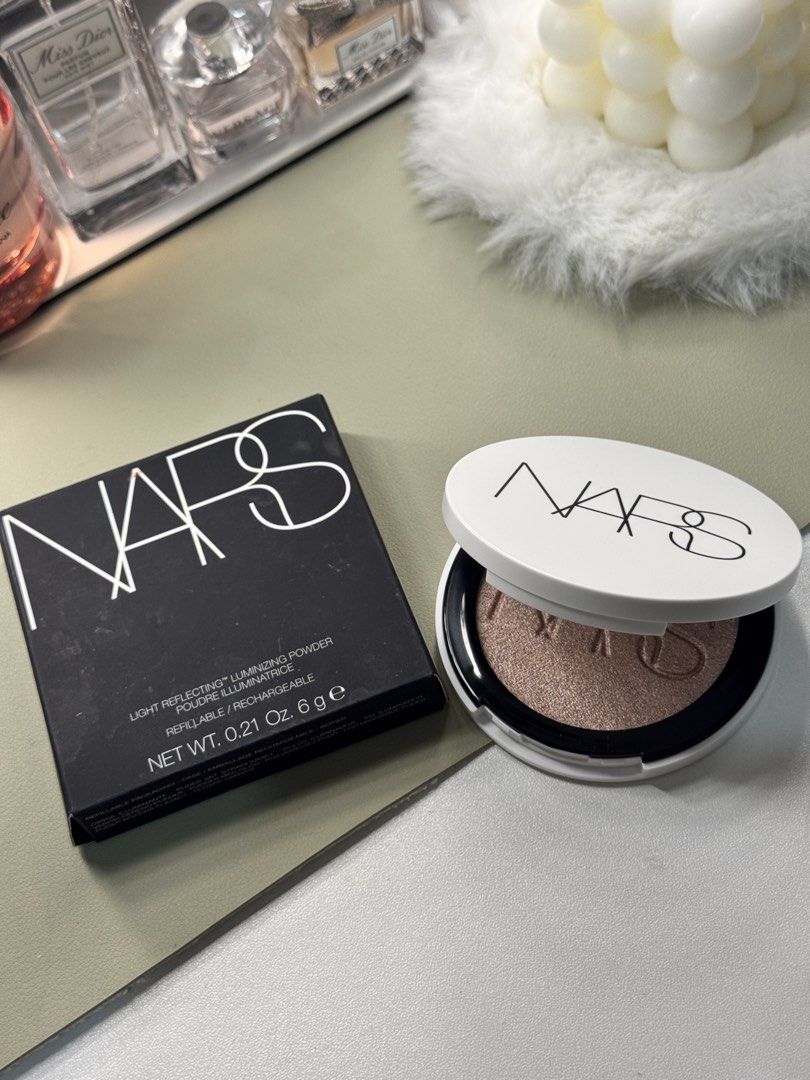 NARS Light Reflecting Luminizing Powder (Category: Makeup) located in Binan City. Submitted by seoulbeauty_cart (Listing ID 1465586006, Image 1). Description: - Brand: Nars - Product: Light Reflecting Luminizing Powder - Shade: Bronze-gold shimmer - Size: 0.21 oz / 6g - Packaging: White refillable compact - Condition: Brand new, unused with original black box intact - Perfect for gifting or personal use.