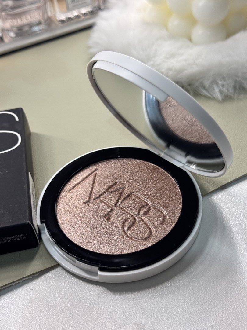 NARS Light Reflecting Luminizing Powder (Category: Makeup) located in Binan City. Submitted by seoulbeauty_cart (Listing ID 1465586006, Image 2). Description: - Brand: Nars - Product: Light Reflecting Luminizing Powder - Shade: Bronze-gold shimmer - Size: 0.21 oz / 6g - Packaging: White refillable compact - Condition: Brand new, unused with original black box intact - Perfect for gifting or personal use.