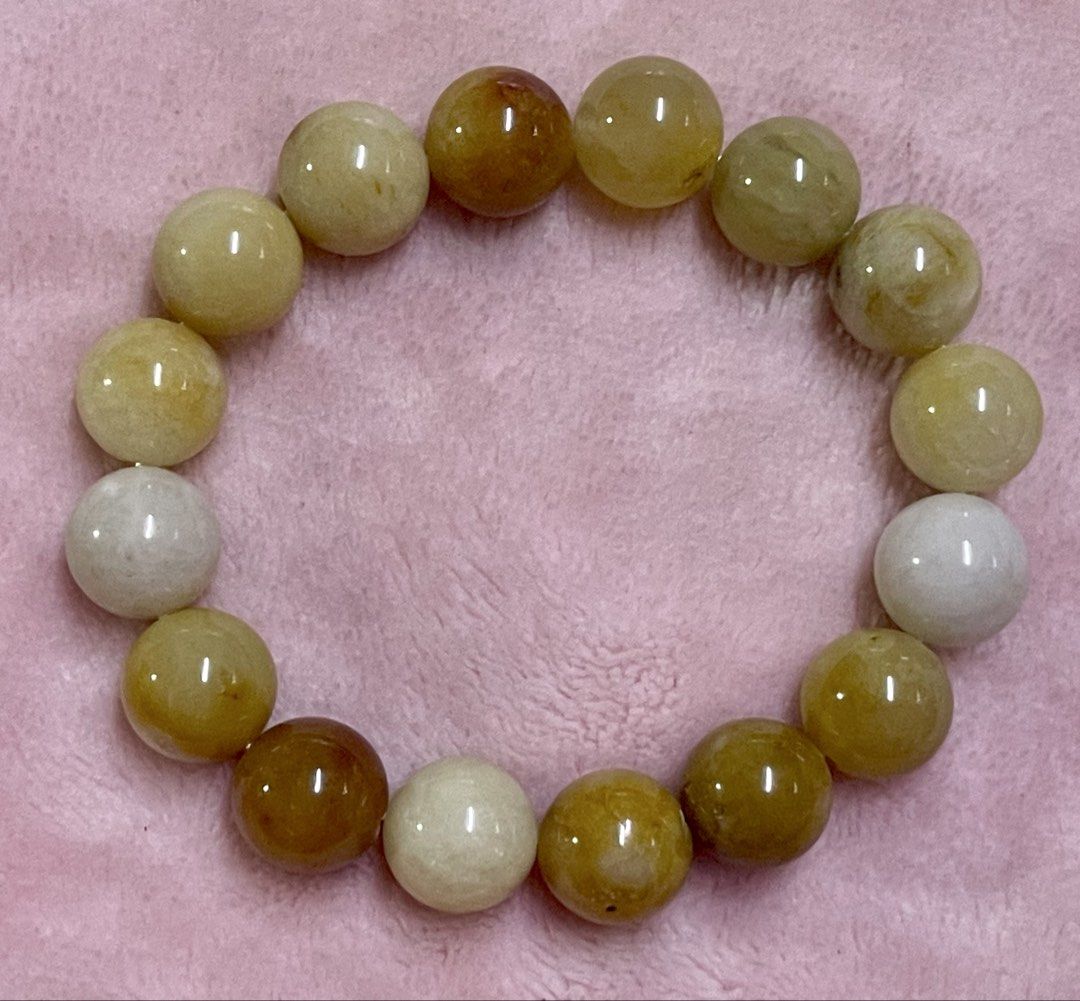 Natural Yellow Fei Cui Bracelet 12mm (Category: Bracelets) located in Manila. Submitted by Crystal_Oracle (Listing ID 1465583862, Image 2). Description: Fei Cui (jadeite jade) is prized for cultural, spiritual, and aesthetic reasons. It is widely believed to attract good fortune, provide protective energy, and promote emotional balance. In traditional beliefs, wearing natural Fei Cui brings harmony and absorbs negative or harmful luck..