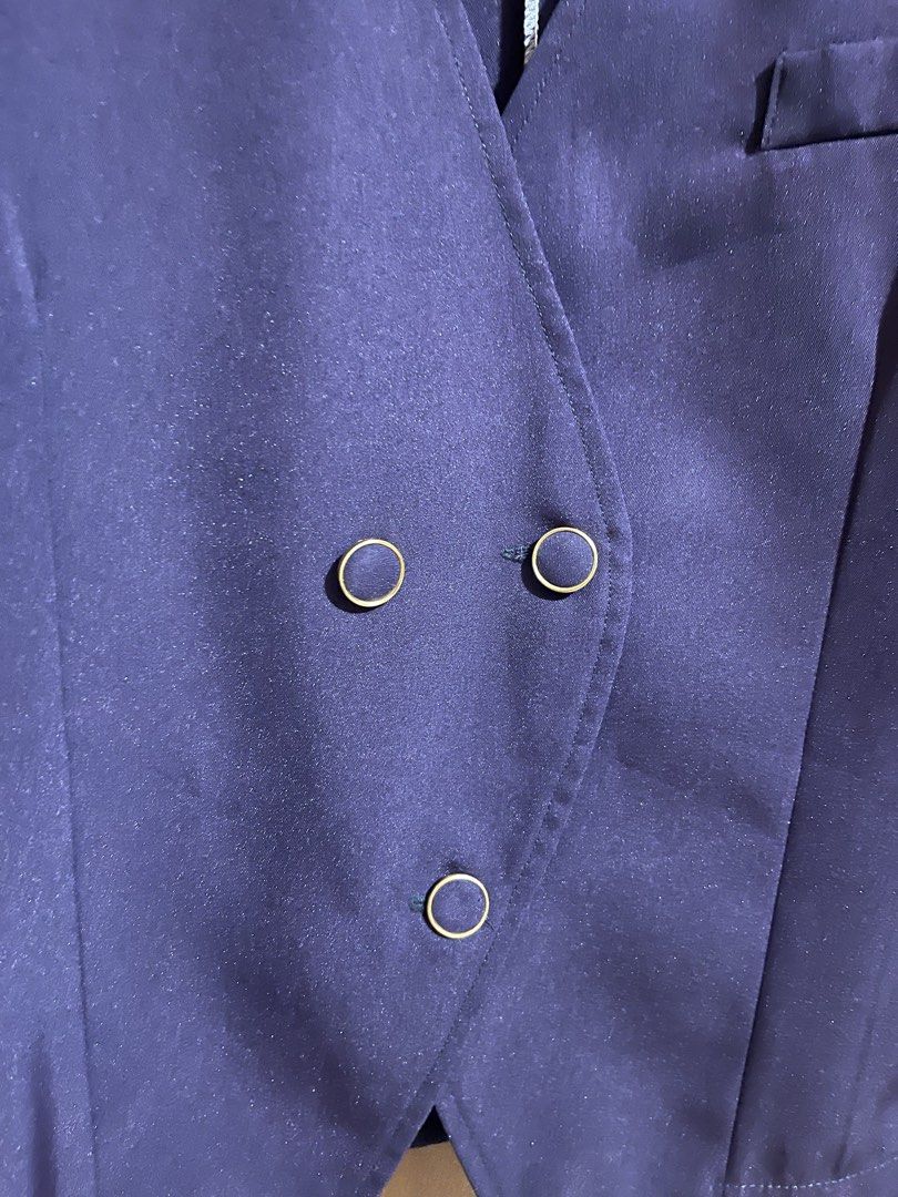 Navy Blue Buttoned Blazer Jacket (Category: Coats, Jackets and Outerwear) located in Pasay City. Submitted by etcunlimited0 (Listing ID 1465687511, Image 3). Description: - Color: Dark navy blue - Style: Collarless V-neck with asymmetrical button front - Details: Gold-rimmed buttons and one small right chest pocket - Fit: Long sleeves with clean stitched seams - Versatility: Perfect layering piece for casual tops or workwear.