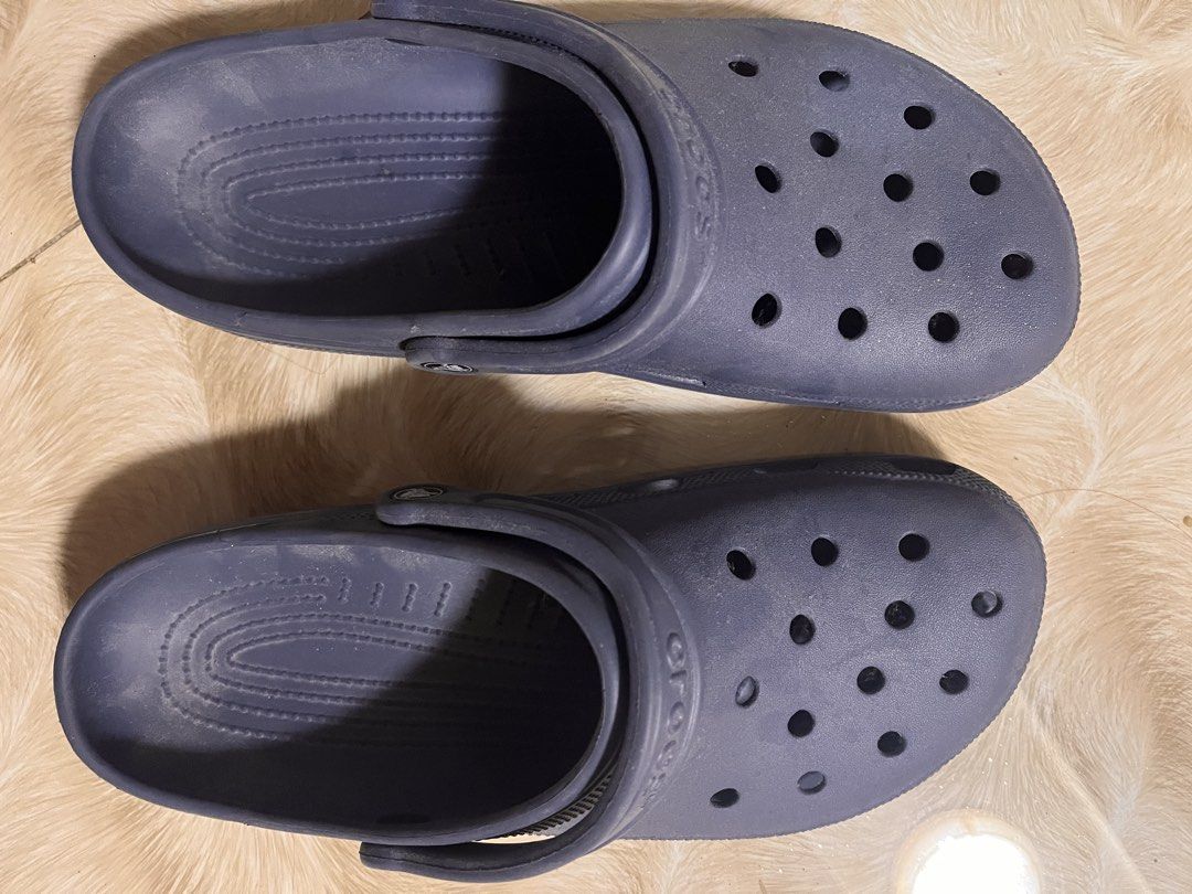 NAVY BLUE CROCS ORIGINAL! (Category: Slippers & Slides) located in Santo Tomas. Submitted by thena.cole (Listing ID 1465713083, Image 1). Description: Good as new, hindi pa nagagamit Naka stock lang kaya madumi, kaya yan ng punas lang NO ISSUE AND ORIGINAL SIZE 11 .