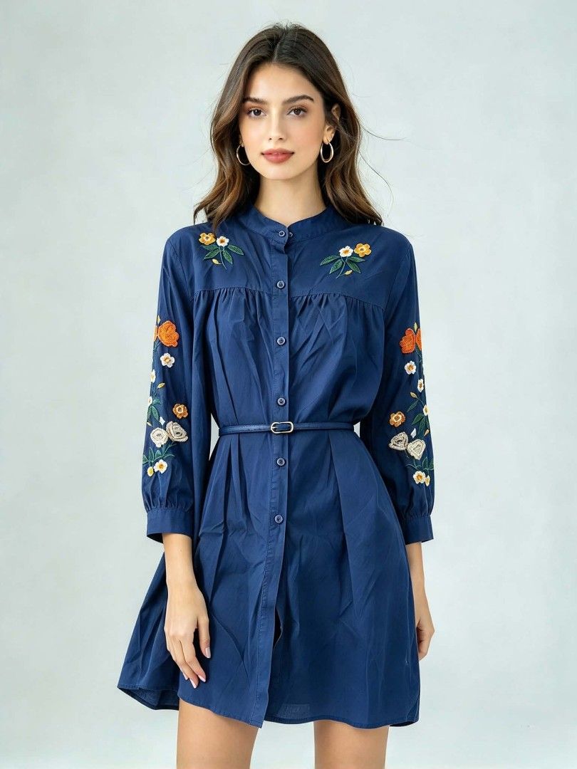 Navy Blue Floral Embroidered Button-Down Blouse (Category: Dresses) located in Caloocan City. Submitted by mylove326 (Listing ID 1464920966, Image 1). Description: - Color: Dark blue with colorful floral embroidery - Style: Button-down with a mandarin collar and loose fit - Details: Gathered accents at the chest and back - Measurements: Approx. 30 inches length, 19 inches sleeves - Material: Soft fabric, perfect for pairing with jeans or skirts S