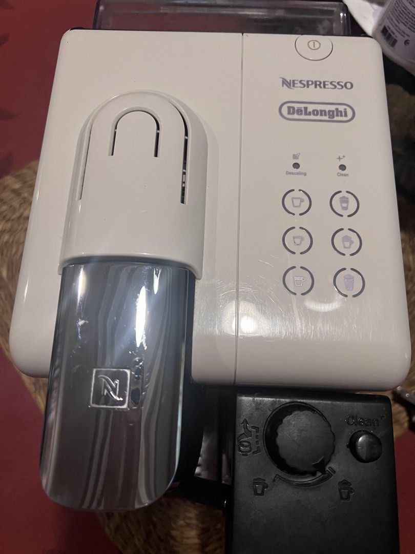 Nespresso DeLonghi Lattissima Touch Coffee Maker White (Category: Coffee Machines & Makers) located in Dasmarinas. Submitted by keilhai02 (Listing ID 1465741442, Image 3). Description: - Model: Nespresso DeLonghi Coffee Maker in sleek white - Milk Frother: Integrated unit for easy lattes and cappuccinos - One-Touch Panel: 6 buttons for espresso, cappuccino, latte, and more - Design: Chrome lever capsule chamber and rear ventilation - Easy Mainten