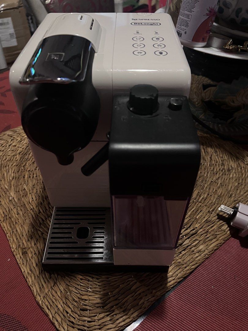 Nespresso DeLonghi Lattissima Touch Coffee Maker White (Category: Coffee Machines & Makers) located in Dasmarinas. Submitted by keilhai02 (Listing ID 1465741442, Image 2). Description: - Model: Nespresso DeLonghi Coffee Maker in sleek white - Milk Frother: Integrated unit for easy lattes and cappuccinos - One-Touch Panel: 6 buttons for espresso, cappuccino, latte, and more - Design: Chrome lever capsule chamber and rear ventilation - Easy Mainten