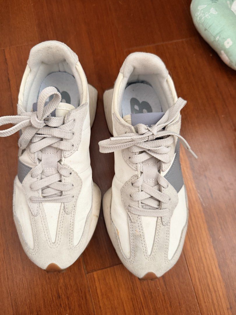 New Balance 327 White Grey Sneakers (Category: Sneakers) located in Quezon City. Submitted by hjane26 (Listing ID 1465637329, Image 1). Description: - Brand: New Balance - Model: 327 Lifestyle Sneakers - Colorway: Off-white and grey with textured grey oversized 'N' logo - Materials: Nylon base with premium suede overlays and grey laces - Soles: Chunky wedge midsole with signature lugged gum rubber outsole wrapping the heel - Condition: Pre-owned 