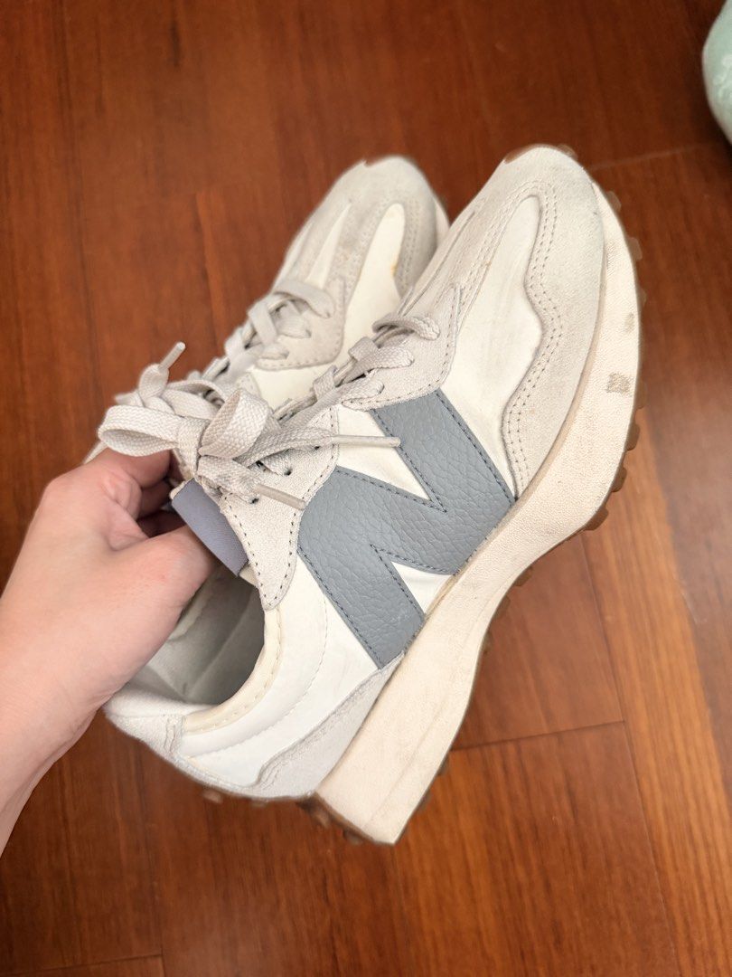 New Balance 327 White Grey Sneakers (Category: Sneakers) located in Quezon City. Submitted by hjane26 (Listing ID 1465637329, Image 3). Description: - Brand: New Balance - Model: 327 Lifestyle Sneakers - Colorway: Off-white and grey with textured grey oversized 'N' logo - Materials: Nylon base with premium suede overlays and grey laces - Soles: Chunky wedge midsole with signature lugged gum rubber outsole wrapping the heel - Condition: Pre-owned 