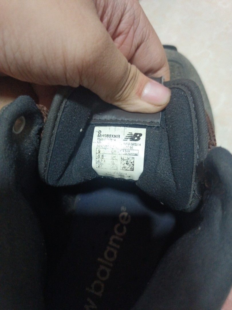 New Balance 988 Brown Sneakers (Category: Sneakers) located in Manila. Submitted by swiftbear_7ed2ec (Listing ID 1465649458, Image 2). Description: - Brand/Model: New Balance 988 Mid (MH988XNB, Mfg Date: 08/2014) - Colorway: brown with matching brown laces - Size: US 9 | UK 8.5 | EU 42.5 | 27 cm - Key Features: Perforated toe boxes, padded ankle collars, sturdy build, and textured outsoles - Condition: Well-loved with a distinct worn look, featur