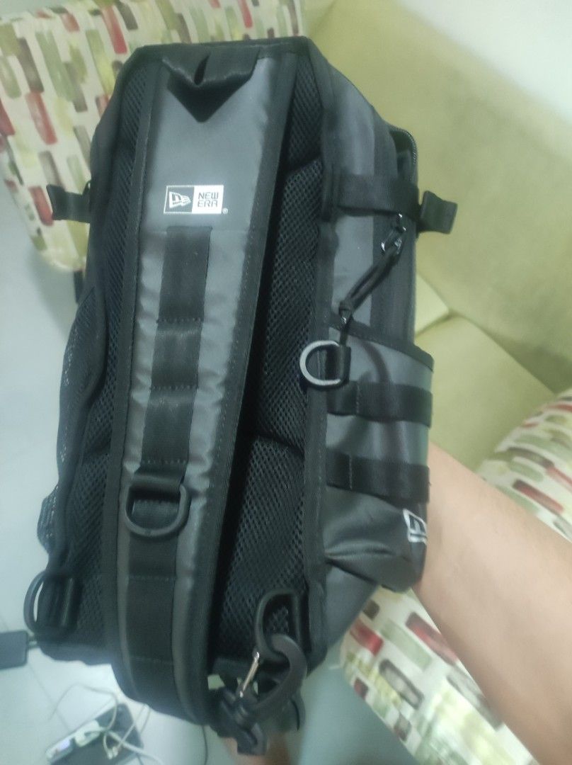 New Era Black Utility Backpack (Category: Backpacks) located in Pasay City. Submitted by wizemindz138970 (Listing ID 1465648555, Image 2). Description: - Brand: New Era - Color: Black (Brand New) - Storage: Multiple zippered compartments & front flap pocket - Pockets: Convenient mesh side pockets for water bottles - Comfort: Adjustable straps for a custom fit - Quality: Durable material with authentic inside tag logo - Usage: Ideal for daily comm