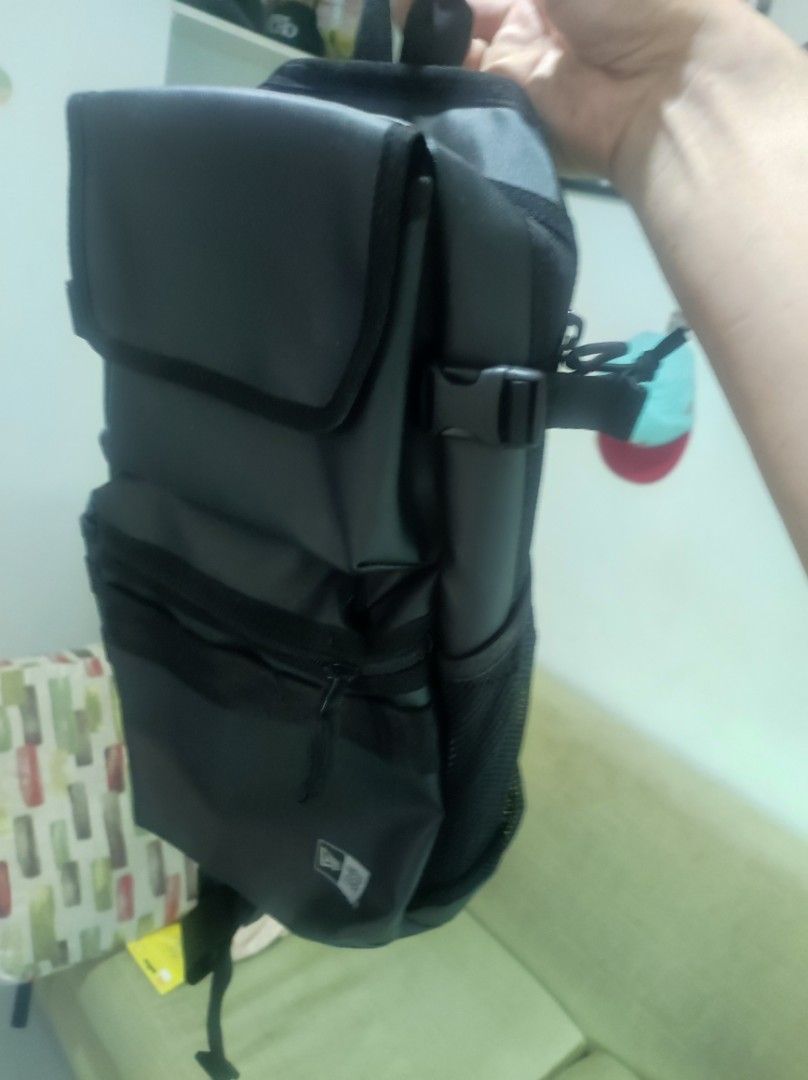 New Era Black Utility Backpack (Category: Backpacks) located in Pasay City. Submitted by wizemindz138970 (Listing ID 1465648555, Image 1). Description: - Brand: New Era - Color: Black (Brand New) - Storage: Multiple zippered compartments & front flap pocket - Pockets: Convenient mesh side pockets for water bottles - Comfort: Adjustable straps for a custom fit - Quality: Durable material with authentic inside tag logo - Usage: Ideal for daily comm