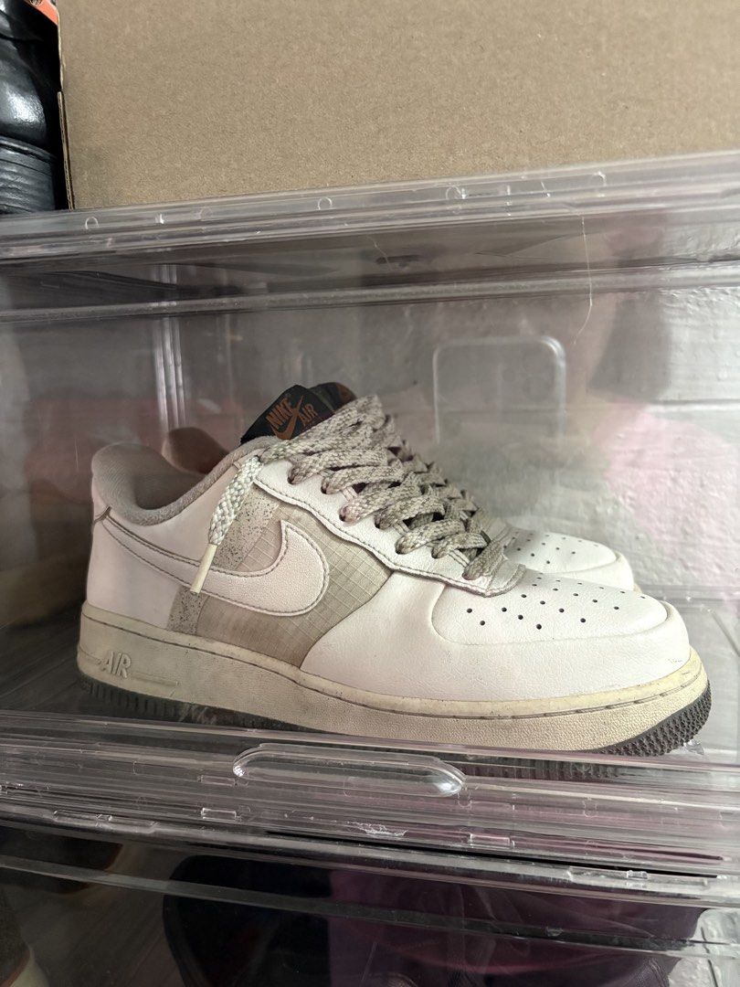 Nike Air Force 1 Sneakers (Category: Casual Shoes) located in Manila. Submitted by bern_salamanca (Listing ID 1465587401, Image 1). Description: - Model: Nike Air Force 1 • Size: US 7.5 / UK 6.5 / EUR 40.5 • Color: Sail/Cream • Condition: Pre-loved / gently used - Colorway: White with olive green tongue and orange Nike Air branding - Unique Details: Grid pattern side panels, textured patterned laces, and speckled dark rubber outsoles - Origin: Ma