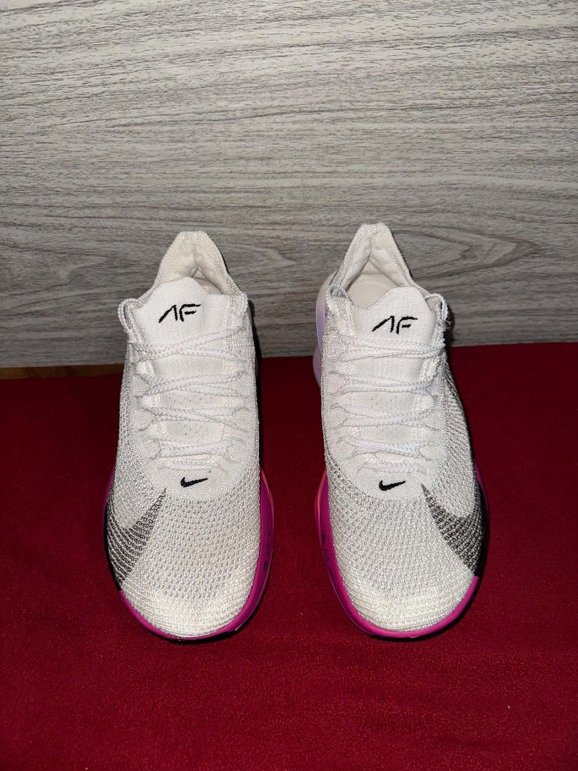 Nike Air Zoom Alphafly (Category: Sneakers) located in Jose Panganiban. Submitted by gg.getsumei (Listing ID 1465625097, Image 1). Description: Nike running shoes featuring a white upper with vibrant pink gradient soles and black swoosh branding. Built with lightweight knit, ZoomX foam, and visible air pods for top-tier performance on training days or races. Ready to wear!.