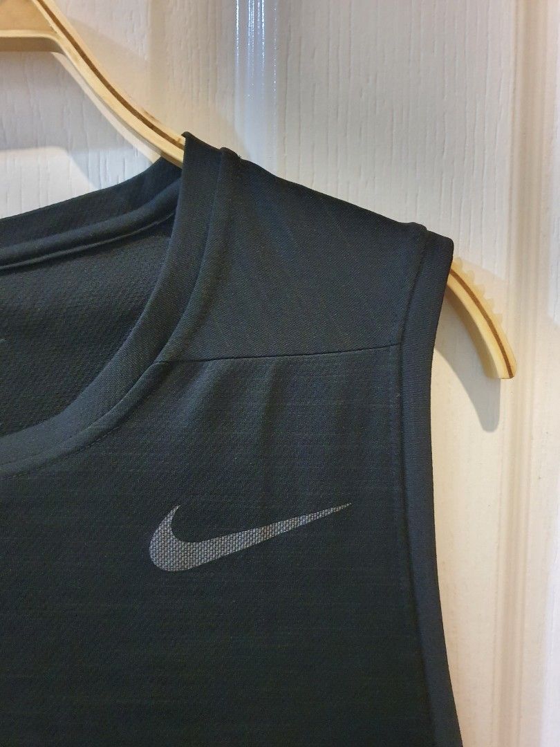 NIKE Dri-FIT Black Workout Tank Top (Category: Activewear) located in Quezon City. Submitted by RepeatOnFleek (Listing ID 1465612142, Image 2). Description: - Brand: Nike - Item: Black training tank top - Size: XXL - Material: 100% polyester with Dri-FIT technology - Features: Lightweight, sleeveless for full arm movement, and iconic chest Swoosh logo -Logo not cracked - Condition: Like new / Great for gym sessions and runs.