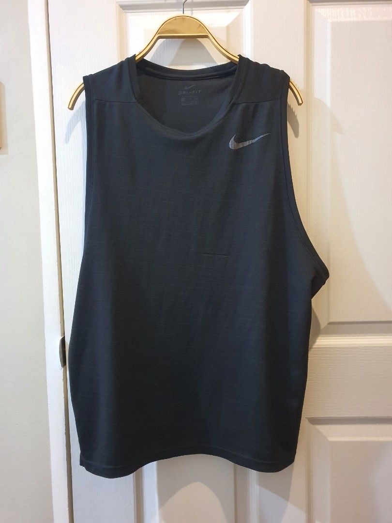 NIKE Dri-FIT Black Workout Tank Top (Category: Activewear) located in Quezon City. Submitted by RepeatOnFleek (Listing ID 1465612142, Image 1). Description: - Brand: Nike - Item: Black training tank top - Size: XXL - Material: 100% polyester with Dri-FIT technology - Features: Lightweight, sleeveless for full arm movement, and iconic chest Swoosh logo -Logo not cracked - Condition: Like new / Great for gym sessions and runs.