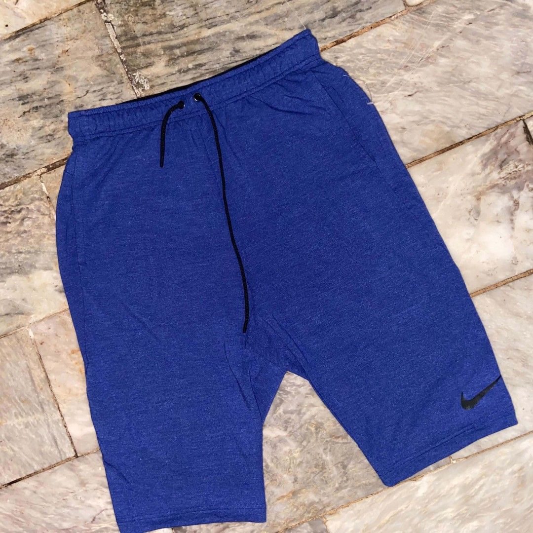 Nike Dri-FIT Blue Athletic Shorts Size M (Category: Shorts) located in Manila. Submitted by ulober213 (Listing ID 1465581812, Image 1). Description: - Brand: Nike - Style: Dri-FIT shorts - Color: Bright blue heathered - Size: Medium - Waistband: Elastic with adjustable black drawstring - Details: Small Nike swoosh logo near bottom hem - Material: Lightweight fabric - Condition: Great for workouts or casual lounging.