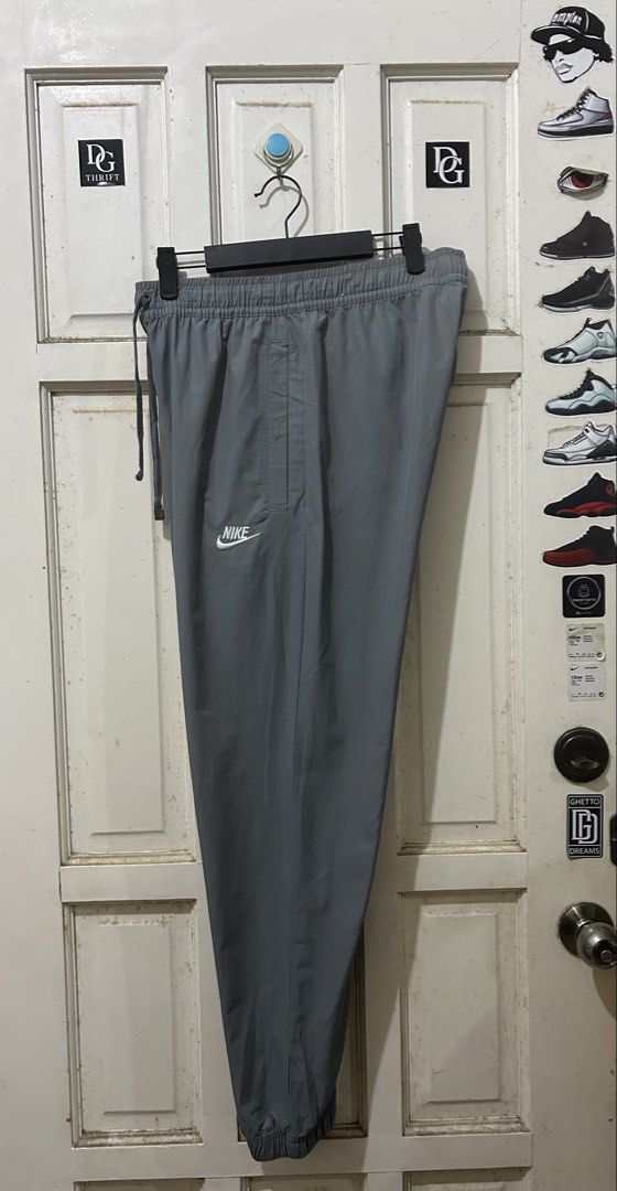 Nike Grey Joggers Sweatpants Track Pants (Category: Joggers) located in Pasay City. Submitted by deguzmanjay (Listing ID 1465675759, Image 1). Description: - Color: Grey - Brand: Nike - Waistband: Elastic with adjustable drawstring - Logo: White embroidered Nike logo on right thigh - Pockets: Convenient side pockets - Hem: Cuffed ankles - Ideal for: Workouts, gym sessions, or casual home lounging.
