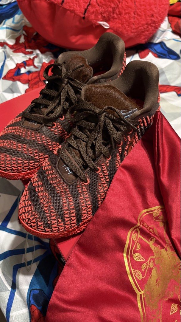 Nike Ja 3 CNY (Category: Sneakers) located in San Fernando. Submitted by dmmq0800 (Listing ID 1465615518, Image 2). Description: - Model: Nike Ja 3 CNY EP (Chinese New Year Edition) - Colorway: Lt Chocolate / Metallic Gold - Silt Red - Size: Men's US 10 - Features: Premium textured brown and red upper with metallic gold swoosh and responsive ZoomX cushioning - Inclusions: Original box and special red dust bag included - Condition: Used thrice in 