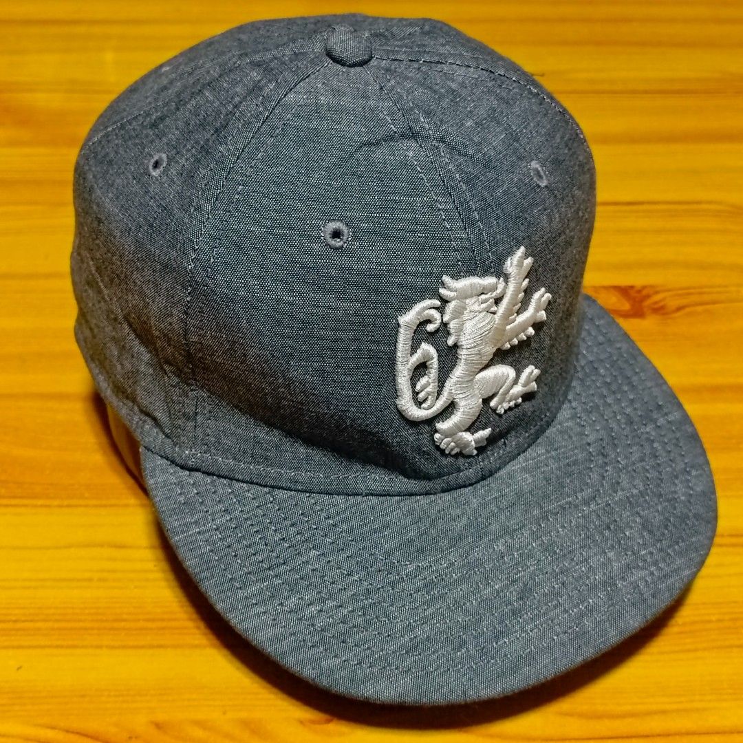 Nike LeBron James LBJ Six Snapback Cap Grey (Category: Caps & Hats) located in Manila. Submitted by caps08 (Listing ID 1465745412, Image 3). Description: Grey heather snapback cap. White embroidered lion graphic on the front panel. Small Nike swoosh embroidered on the side. LBJ SIX text embroidered above the back strap. Adjustable plastic snap closure in black. Structured crown, flat brim style..