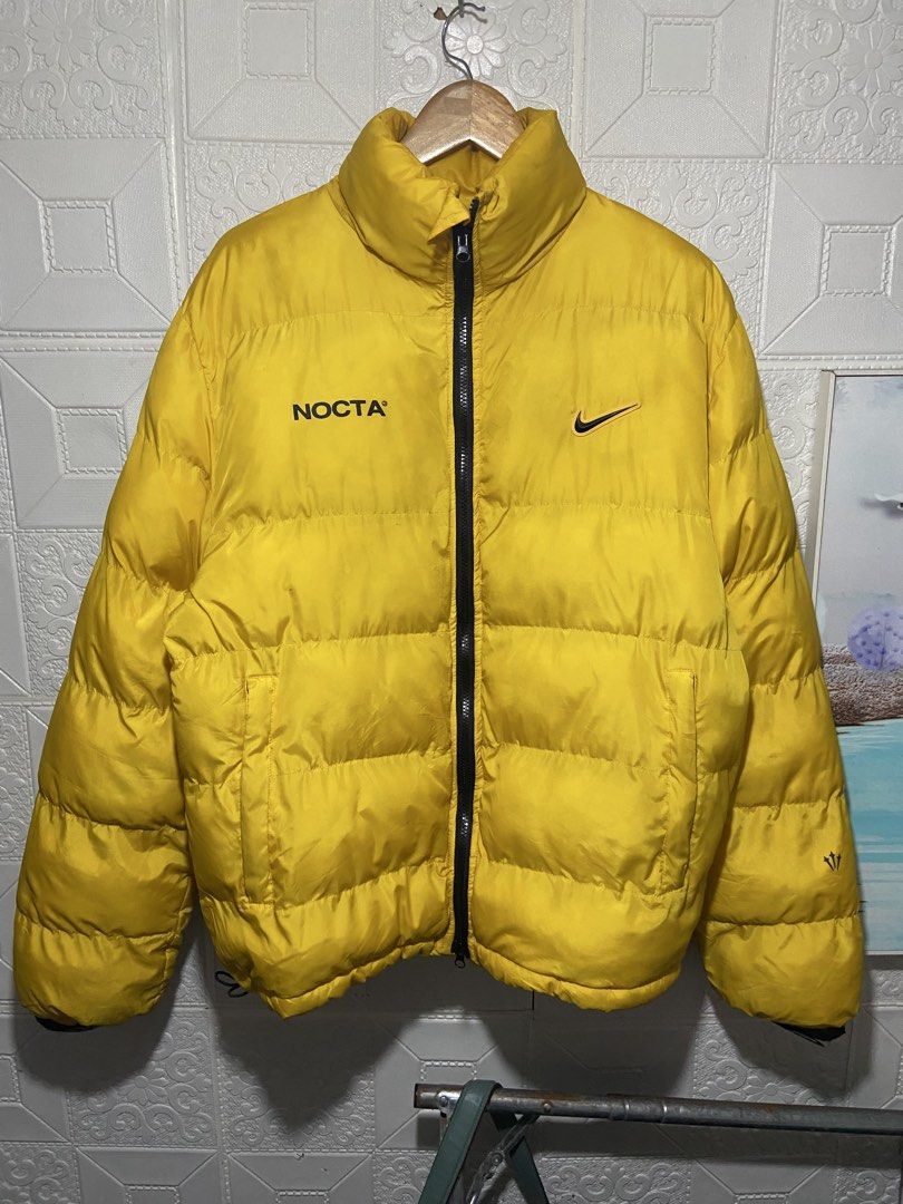 nike nocta x drake puffer jacket (Category: Coats, Jackets and Outerwear) located in Baguio. Submitted by stickygarments (Listing ID 1465650065, Image 1). Description: nike x drake nocta puffer jacket condition:verygood need wash large dimes:24x28 .