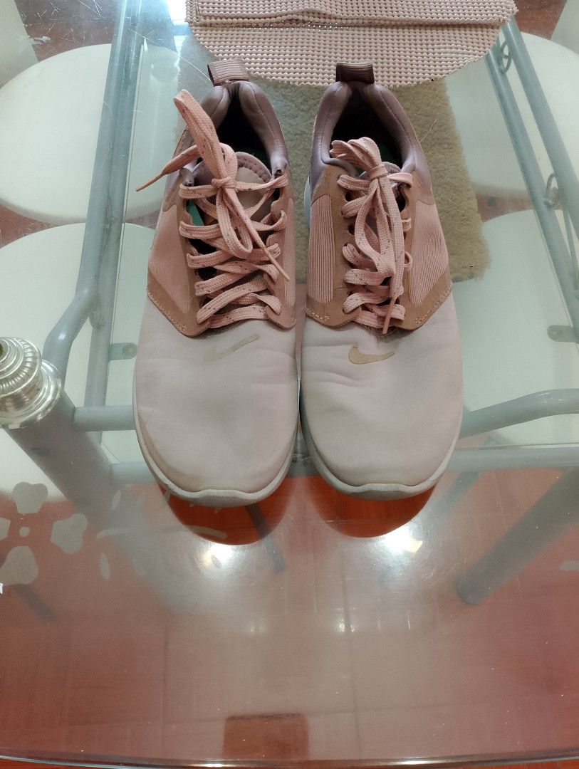 Nike Pink Running Shoes Sneakers (Category: Sneakers) located in Carmona. Submitted by 060118 (Listing ID 1465584440, Image 1). Description: - Brand: Nike running shoes - Colorway: Pink and rose gold with mint green interior lining - Size: US 7.5-8 women size - Condition: Good, with some visible wear on the white soles - Features: Lace-up closure, comfortable fit ideal for training or casual daily wear.