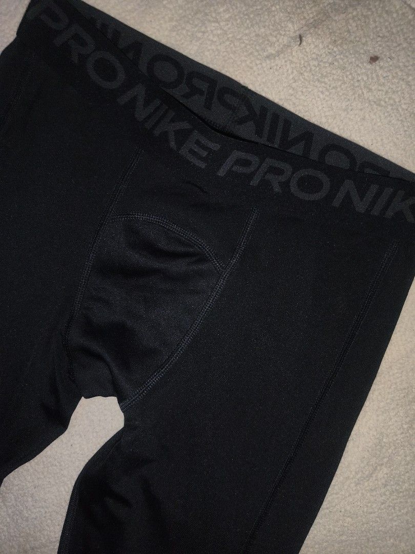 Nike Pro Black Compression Tights Leggings (Category: Activewear) located in Cagayan de Oro. Submitted by elijah350below (Listing ID 1465681554, Image 2). Description: - Brand: Nike Pro - Color: Classic Black - Size: Standard fit - Features: Elastic logo waistband, white swoosh on lower left leg - Material: Breathable, stretchy athletic fabric - Design: Paneled construction for maximum mobility and active movement - Condition: Excellent / Pre-lov