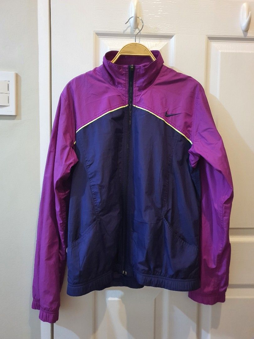 Nike Purple and Blue Windbreaker Jacket (Category: Coats, Jackets and Outerwear) located in Quezon City. Submitted by RepeatOnFleek (Listing ID 1465613483, Image 1). Description: - Brand/Style: Nike Windbreaker - Colorway: Purple and dark blue - Size: Medium -Polyester with breathable mesh lining - Features: Full YKk zip front, clean inner tag - Condition: Excellent, great for running or casual wear.