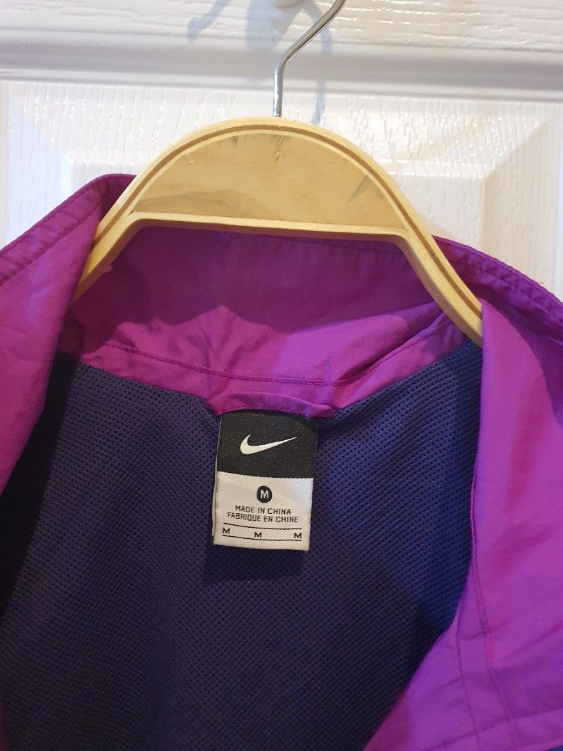 Nike Purple and Blue Windbreaker Jacket (Category: Coats, Jackets and Outerwear) located in Quezon City. Submitted by RepeatOnFleek (Listing ID 1465613483, Image 3). Description: - Brand/Style: Nike Windbreaker - Colorway: Purple and dark blue - Size: Medium -Polyester with breathable mesh lining - Features: Full YKk zip front, clean inner tag - Condition: Excellent, great for running or casual wear.