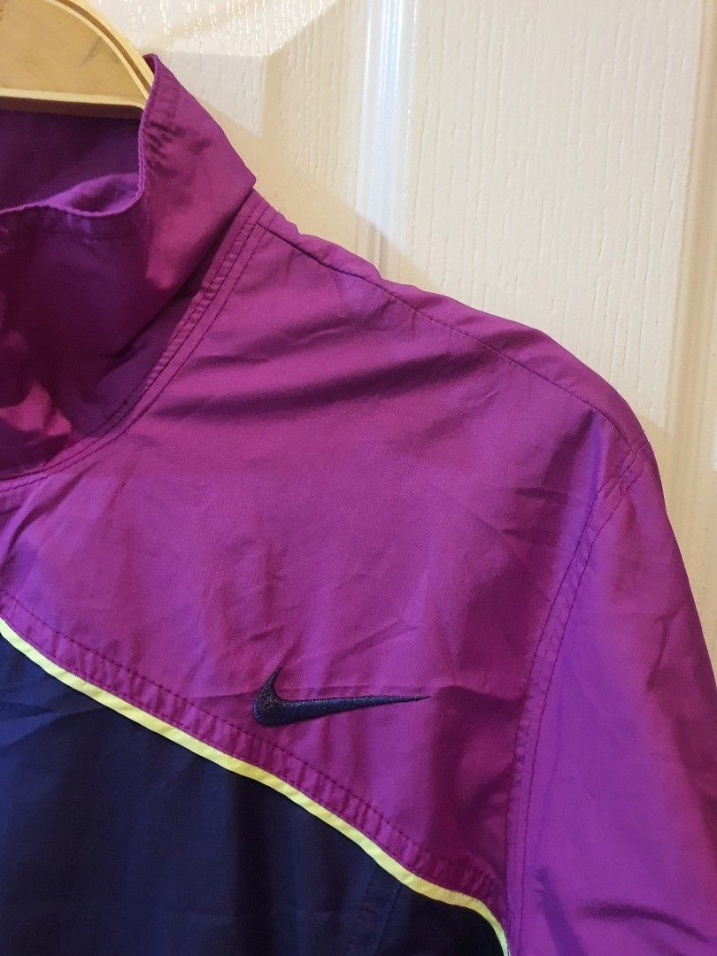 Nike Purple and Blue Windbreaker Jacket (Category: Coats, Jackets and Outerwear) located in Quezon City. Submitted by RepeatOnFleek (Listing ID 1465613483, Image 2). Description: - Brand/Style: Nike Windbreaker - Colorway: Purple and dark blue - Size: Medium -Polyester with breathable mesh lining - Features: Full YKk zip front, clean inner tag - Condition: Excellent, great for running or casual wear.
