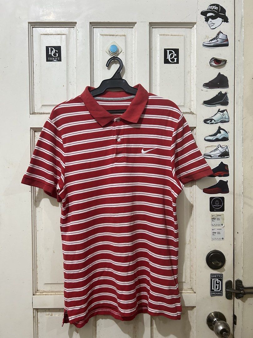 Nike Red Striped Polo Shirt (Category: Tshirts & Polo Shirts ) located in Pasay City. Submitted by deguzmanjay (Listing ID 1465674673, Image 1). Description: - Brand: Nike - Color: Red and white stripes - Design: Classic collar, two-button placket, embroidered white swoosh logo on left chest - Fit: Standard fit with short sleeves - Versatility: Ideal for casual days or golf outings - Condition: Clean and well-maintained.