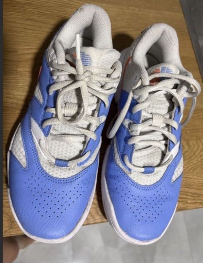 Nike Sneakers White and Blue (Category: Sneakers) located in San Fernando. Submitted by lemon5311 (Listing ID 1465731153, Image 2). Description: - Brand: Nike court shoes - Color: White and blue with orange accents - Material: Mesh and leather upper, rubber sole - Closure: Lace-up with white laces - Condition: Pre-loved with normal signs of use - Best for: Comfortable everyday wear.