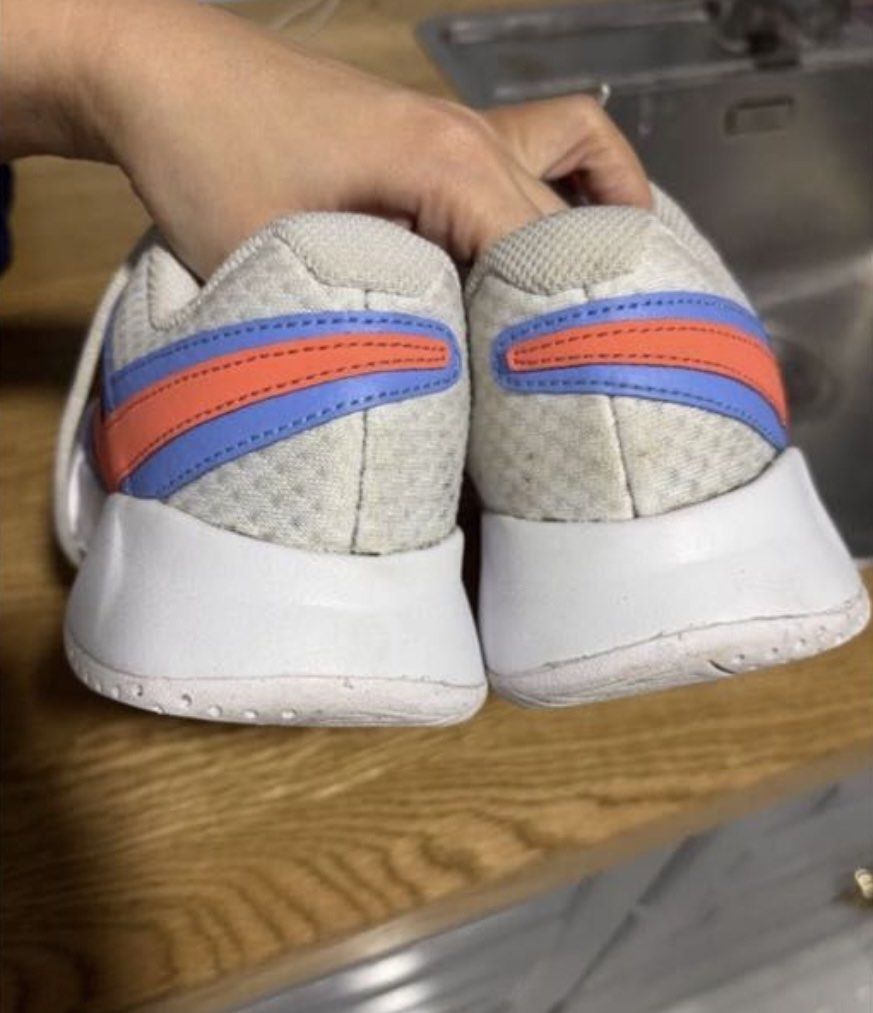 Nike Sneakers White and Blue (Category: Sneakers) located in San Fernando. Submitted by lemon5311 (Listing ID 1465731153, Image 3). Description: - Brand: Nike court shoes - Color: White and blue with orange accents - Material: Mesh and leather upper, rubber sole - Closure: Lace-up with white laces - Condition: Pre-loved with normal signs of use - Best for: Comfortable everyday wear.