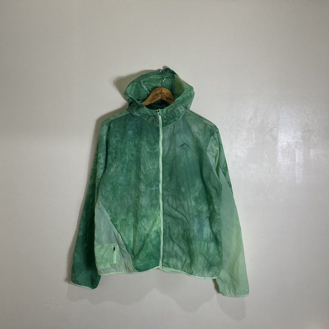 Nike Trail Green Windbreaker Jacket Size L (Category: Coats, Jackets and Outerwear) located in Manila. Submitted by carbertjakosalem (Listing ID 1465754579, Image 1). Description: - Brand: Nike Trail - Item: Lightweight hooded windbreaker jacket - Color: Green - Size: Large (tag attached) - Features: Full zip, packs down into its own built-in pouch - Ideal for: Running, hiking, and outdoor activities - Origin: Made in Cambodia - Condition: Brand 