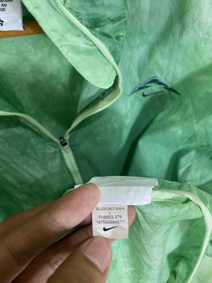 Nike Trail Green Windbreaker Jacket Size L (Category: Coats, Jackets and Outerwear) located in Manila. Submitted by carbertjakosalem (Listing ID 1465754579, Image 2). Description: - Brand: Nike Trail - Item: Lightweight hooded windbreaker jacket - Color: Green - Size: Large (tag attached) - Features: Full zip, packs down into its own built-in pouch - Ideal for: Running, hiking, and outdoor activities - Origin: Made in Cambodia - Condition: Brand 