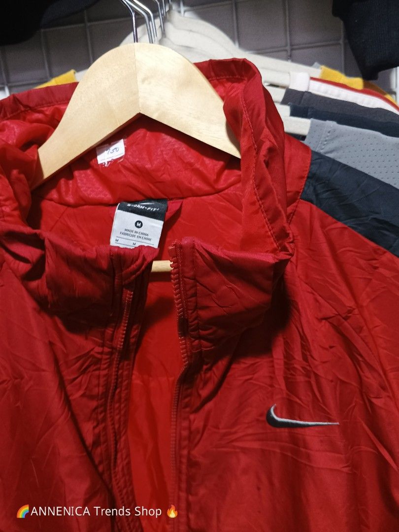 NIKE WINDBREAKER STORM FIT JACKET (Category: Coats, Jackets and Outerwear) located in Bulacan. Submitted by annenicathriftthriftlang (Listing ID 1465597310, Image 2). Description: 🔥 NIKE STORM-FIT WINDBREAKER JACKET 🔥 ✅ DETAILS: Brand: Nike Storm-FIT (legit tag) Color: Red / Black / Grey Two-tone - ang angas! Size: M on tag - 170/88A Chest: 95cm | Height: 165-175cm fit Best Fit: Medium to Large Type: Light Puffer / Windbreaker - pang motor, pan