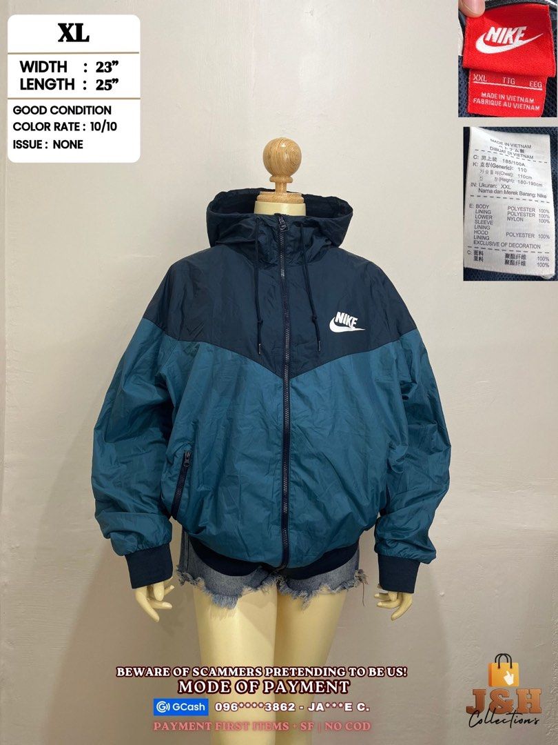Nike Windrunner Hooded Jacket Navy Teal Blue (Category: Coats, Jackets and Outerwear) located in Rizal. Submitted by jajascmpo (Listing ID 1465715274, Image 1). Description: - Brand: Nike - Style: Hooded jacket in navy and teal colorblock with white chest logo - Size: Tagged XXL (Actual measurements: Width 23", Length 25") - Features: Full zip front, adjustable drawstrings, elastic cuffs and hem - Material: 100% polyester with nylon lower sleeve 