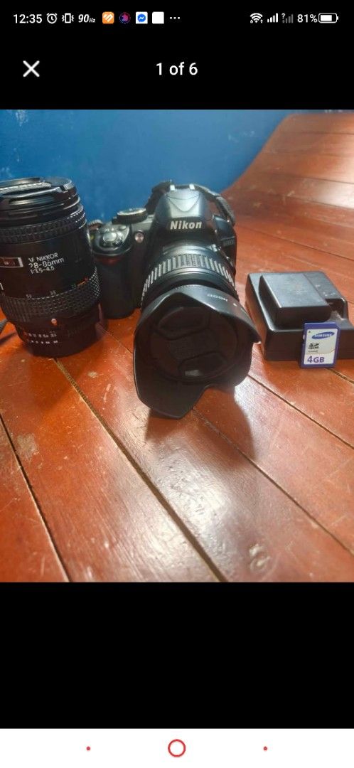 Nikon d3100 DSLR Camera Bundle with Lenses and Charger (Category: Cameras) located in Cavite. Submitted by victor.rv (Listing ID 1465615907, Image 1). Description: - Complete Nikon DSLR camera body and accessories ready to shoot - Two lenses included: mounted lens plus an extra AF Nikkor 28-85mm zoom lens - Includes original battery charger unit - Comes with a 4GB Samsung SD memory card - Tested and working well, perfect for beginners and hobbyis