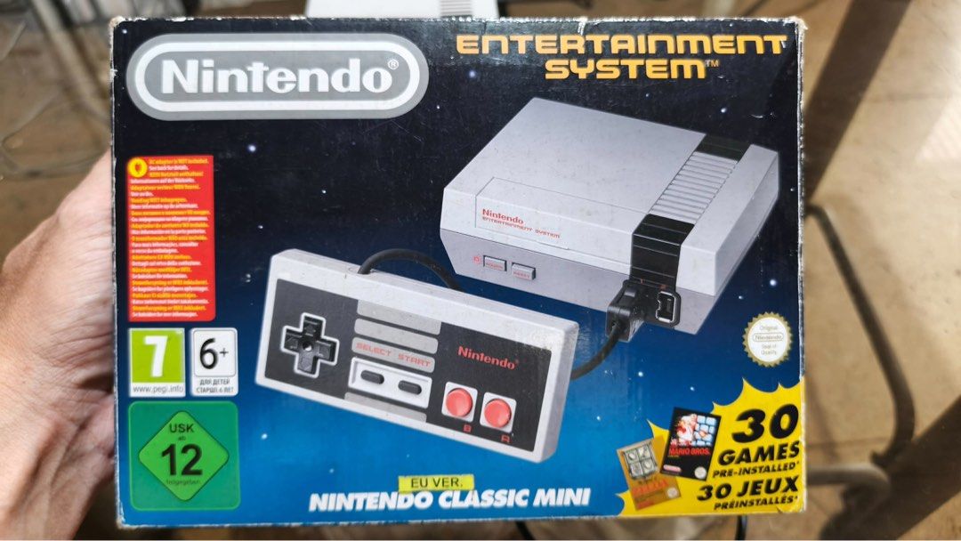 Nintendo Classic With 120 games (Plug and Play) (Category: Nintendo) located in Marikina City. Submitted by patriciaoriendo2 (Listing ID 1465678521, Image 3). Description: - Condition: Tested and working, comes with original box - What's included: Console and two wired controllers - Games: 30 pre-installed retro classics including Super Mario Bros 3 and Pac-Man - Setup: Easy HDMI plug-and-play for your TV - Perfect for: Game rooms and retro gamin