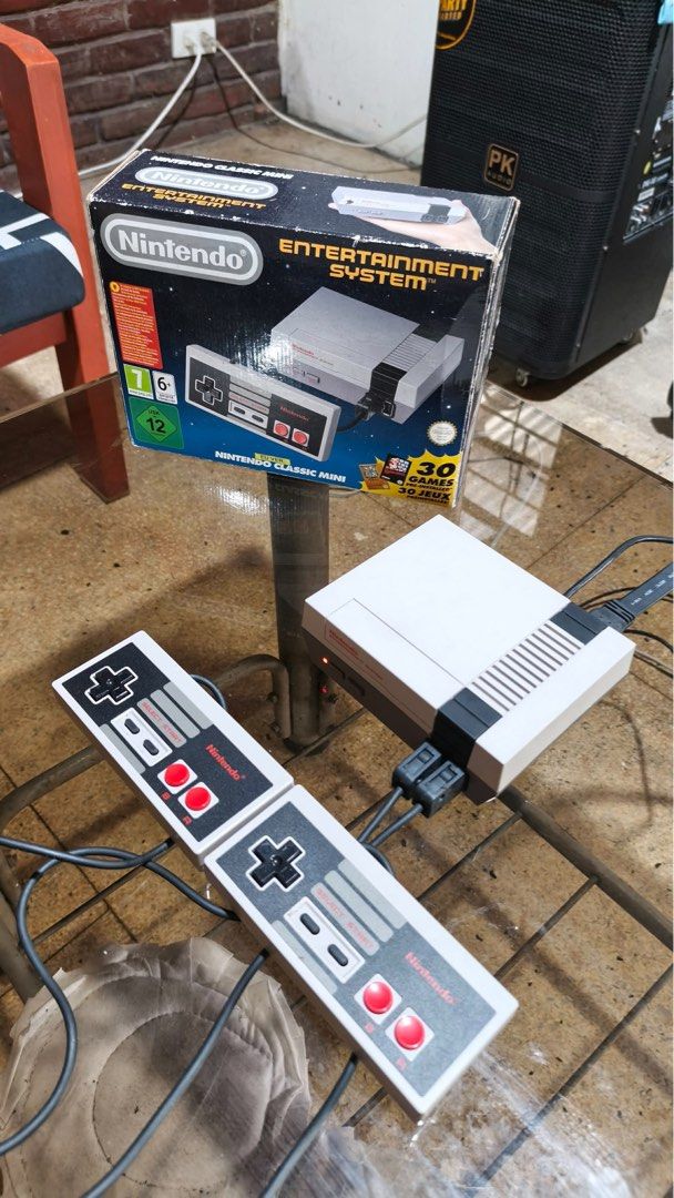 Nintendo Classic With 120 games (Plug and Play) (Category: Nintendo) located in Marikina City. Submitted by patriciaoriendo2 (Listing ID 1465678521, Image 1). Description: - Condition: Tested and working, comes with original box - What's included: Console and two wired controllers - Games: 30 pre-installed retro classics including Super Mario Bros 3 and Pac-Man - Setup: Easy HDMI plug-and-play for your TV - Perfect for: Game rooms and retro gamin