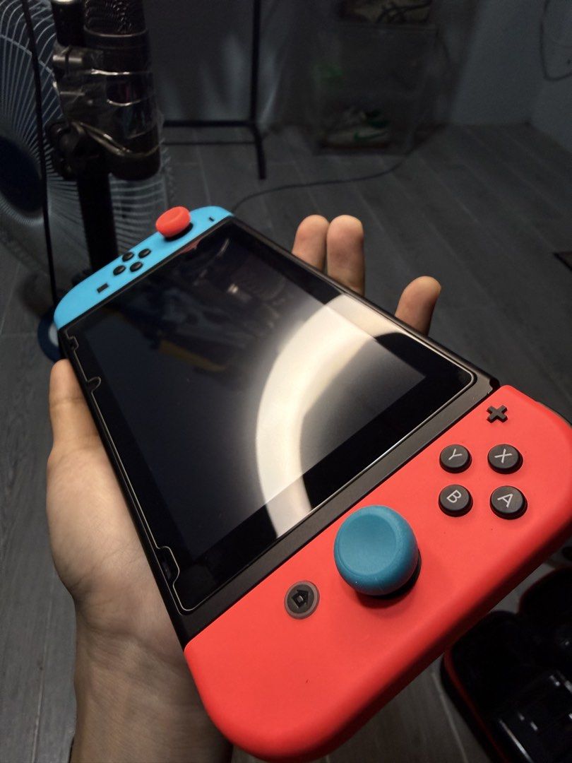 Nintendo Switch Console with Accessories (Category: Nintendo) located in Santa Cruz. Submitted by miikachuuu (Listing ID 1465708316, Image 2). Description: - Nintendo Switch Console (Neon Blue & Red Joy-Cons with wrist straps) - Hard carrying case and clear protective case included - Condition: Great shape, well-maintained, and ready for gaming, mint - Meetup or shipping options available across PH.