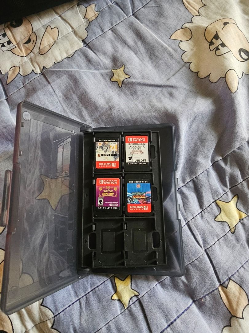 Nintendo Switch OLED Console Bundle with Games and Case (Category: Nintendo) located in Caloocan City. Submitted by chawnn (Listing ID 1465645767, Image 3). Description: - Nintendo Switch OLED Model (White & Black) in fully functional condition - Screen is clean and Joy-Cons work perfectly - Includes original box, power adapter, and a protective carrying case - Physical games included: God Eater 3, Assassin's Creed: The Rebel Collection, Pokémon 